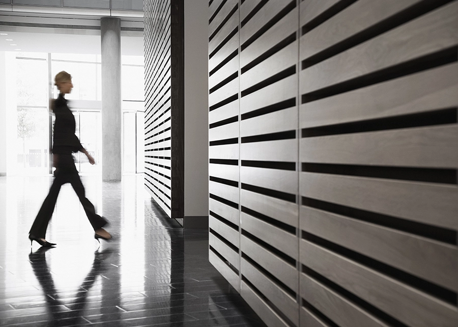 Formally dressed woman entering a business environment